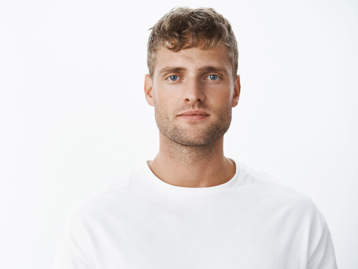 waist-up-shot-handsome-calm-blond-blue-eyed-guy-with-bristle-white-t-shirt-looking-front-with-relaxed-carefree-facial-expression-posing-gray-wall-looking-sincere-chill 1-1 waist-up-shot-handsome-calm-blond-blue-eyed-guy-with-bristle-white-t-shirt-looking-front-with-relaxed-carefree-facial-expression-posing-gray-wall-looking-sincere-chill 1-1